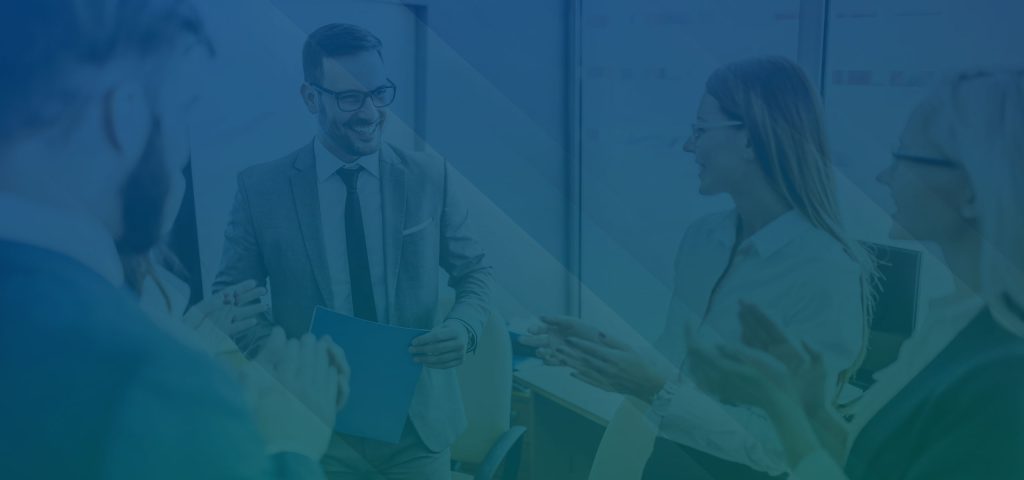 A team of young business people smiling while discussing business plans in a meeting